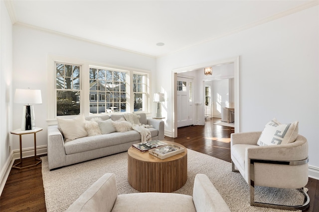 living room featuring dark hardwood / wood-style flooring and ornamental molding