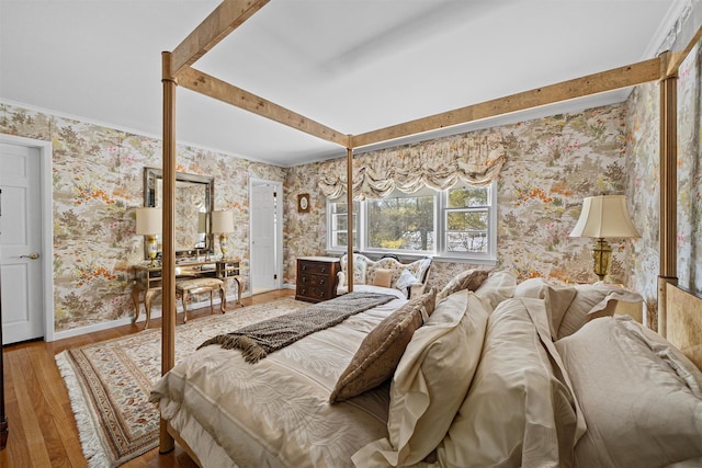 bedroom with hardwood / wood-style floors