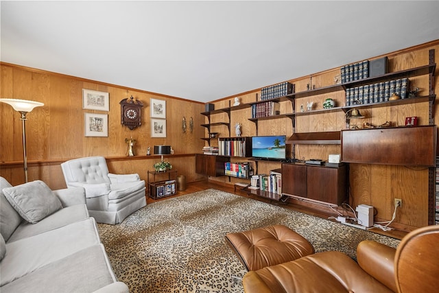 living room with wood walls