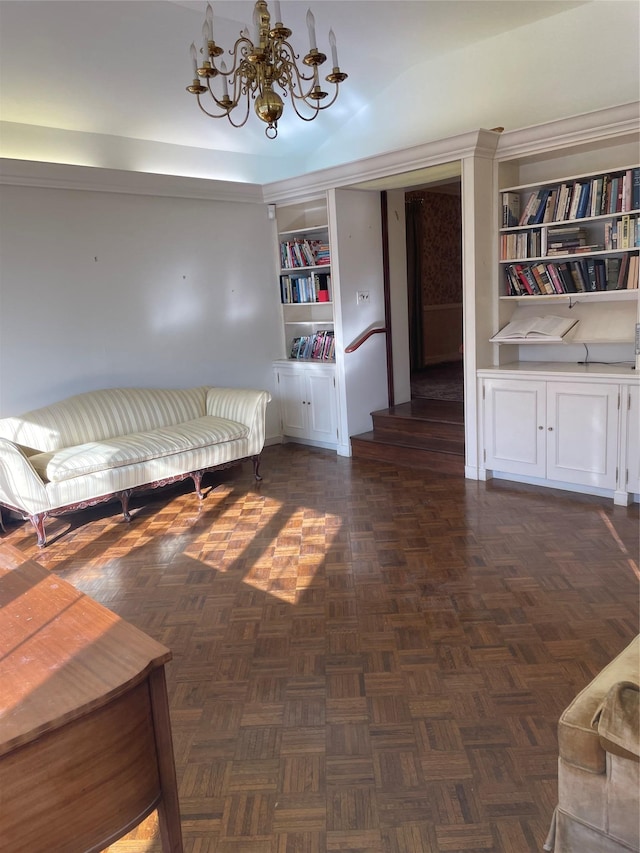 unfurnished room featuring dark parquet floors, a chandelier, and built in shelves