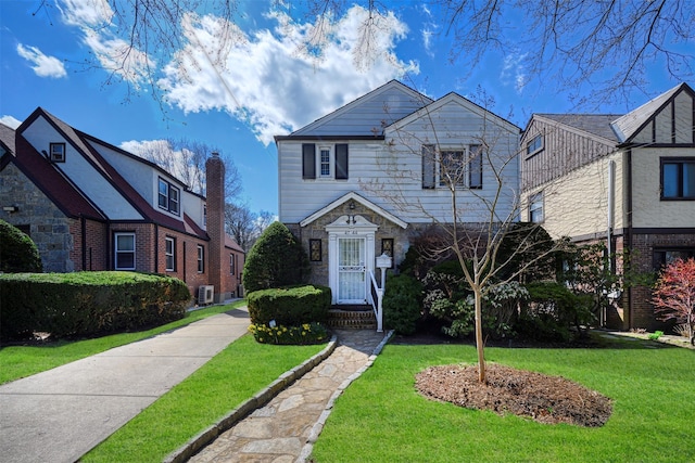 47-44 Glenwood St, Little Neck, NY 11362 - view of front of property featuring a front yard and central air condition unit