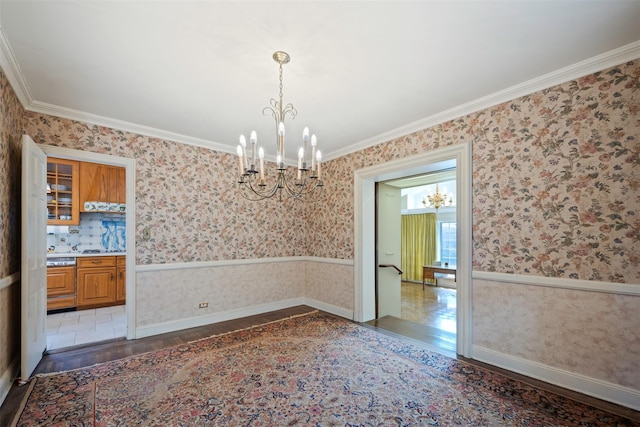 47-44 Glenwood St, Little Neck, NY 11362 - unfurnished room featuring a chandelier, wood finished floors, wallpapered walls, ornamental molding, and baseboards
