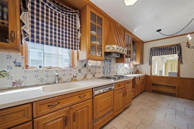 47-44 Glenwood St, Little Neck, NY 11362 - kitchen with radiator, paneled dishwasher, brown cabinetry, stainless steel gas cooktop, and light countertops