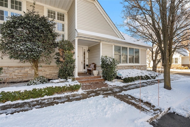 view of snow covered property entrance