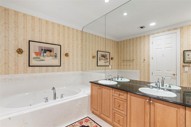 bathroom with vanity, tiled tub, ornamental molding, and tile patterned floors