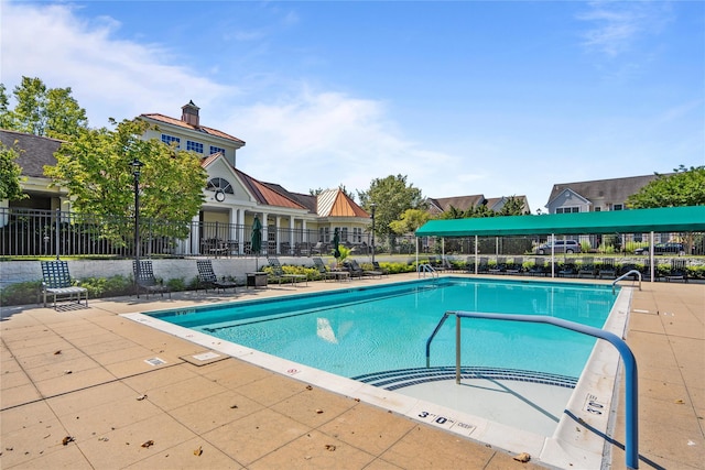 view of swimming pool featuring a patio area