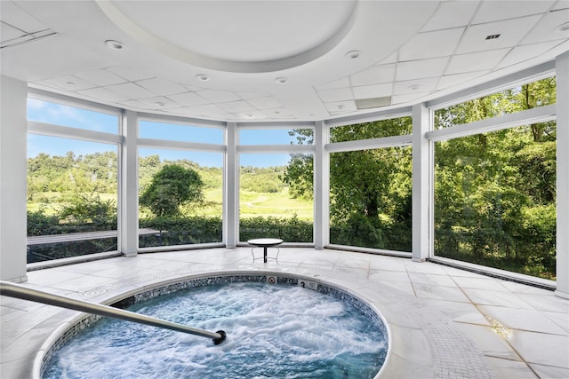 view of swimming pool with an indoor in ground hot tub