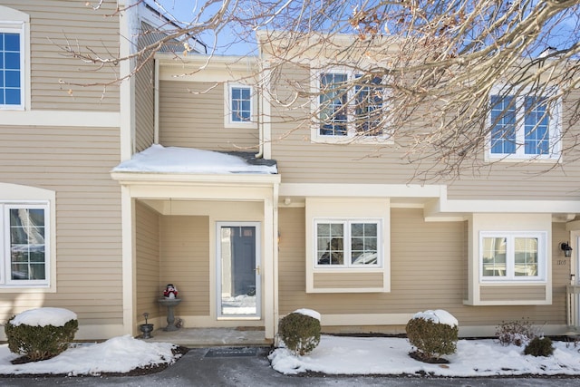 view of snow covered property entrance