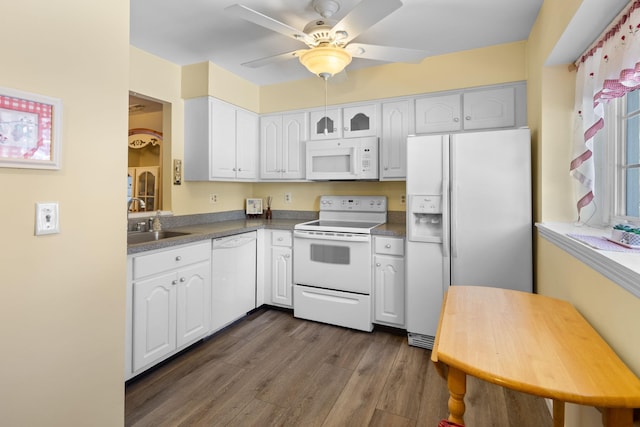 kitchen featuring dark wood-type flooring, sink, ceiling fan, white appliances, and white cabinets