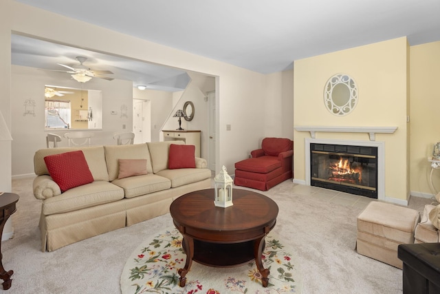 living room with light colored carpet and ceiling fan