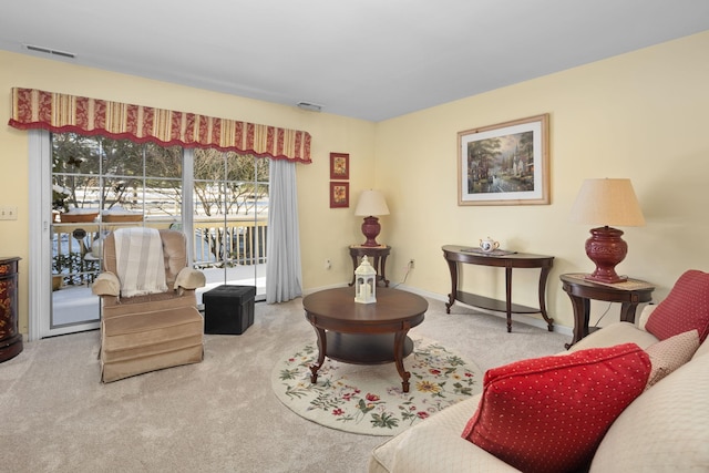 living area with light colored carpet