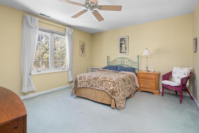 bedroom with ceiling fan and carpet