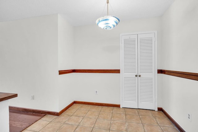 25 Rockledge Ave Unit 906W, White Plains, NY 10601 - unfurnished dining area with light tile patterned floors and baseboards
