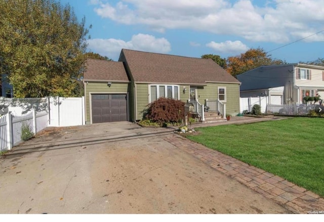 view of front of house featuring a garage and a front yard