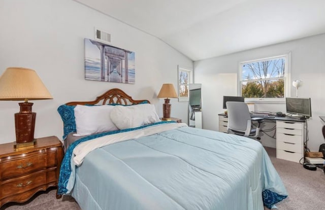 carpeted bedroom featuring lofted ceiling