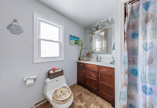 bathroom featuring vanity, toilet, and curtained shower