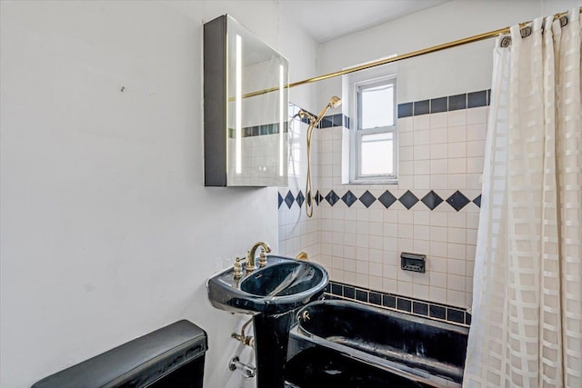 bathroom with sink and shower / tub combo