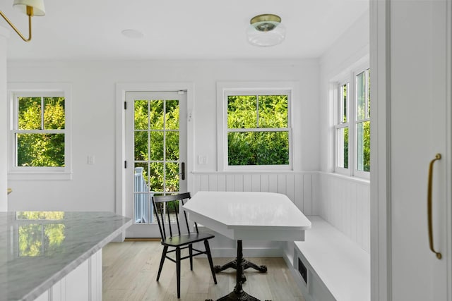 interior space featuring breakfast area and light hardwood / wood-style floors