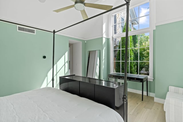 bedroom featuring ceiling fan and light hardwood / wood-style flooring