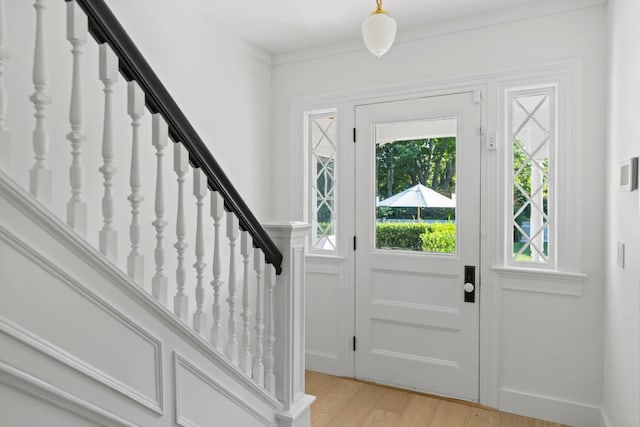 foyer entrance with light wood-type flooring