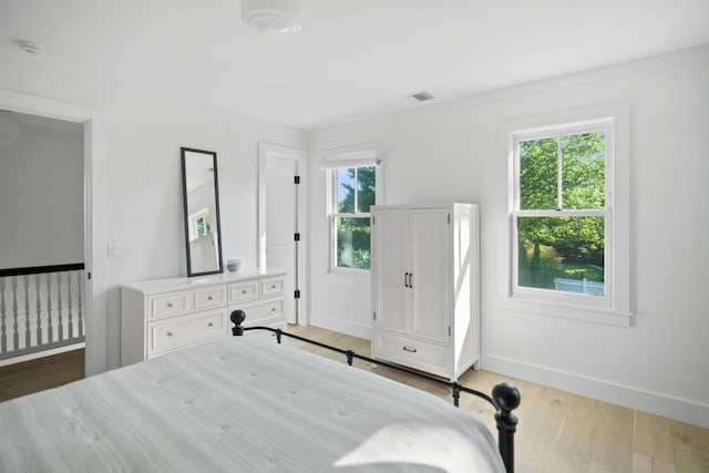 unfurnished bedroom with light wood-type flooring