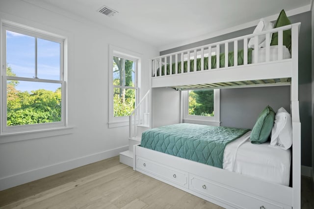 bedroom with hardwood / wood-style floors