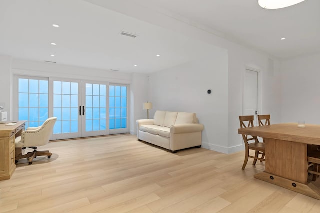 office area with light hardwood / wood-style floors