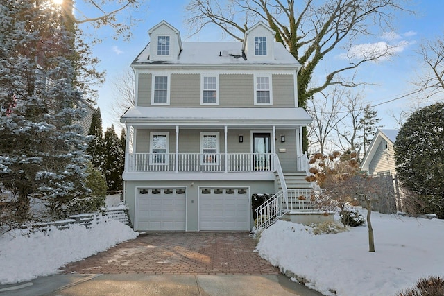 view of front of home with a garage and a porch