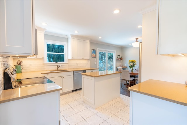 kitchen with stainless steel dishwasher, a sink, recessed lighting, and ornamental molding