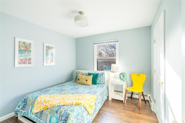 bedroom with wood finished floors