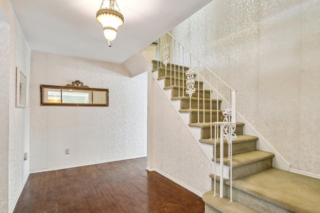 stairway featuring wood-type flooring