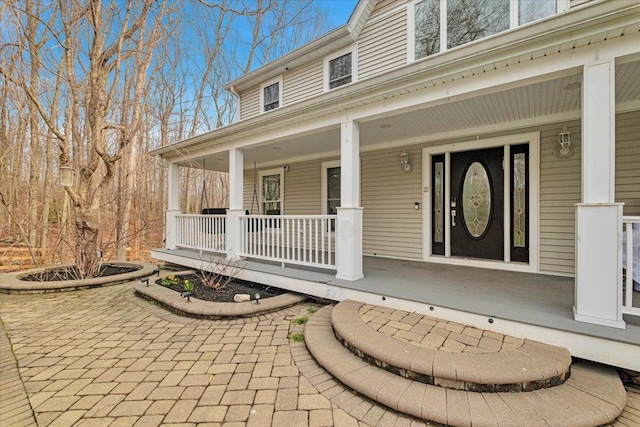 entrance to property with a porch