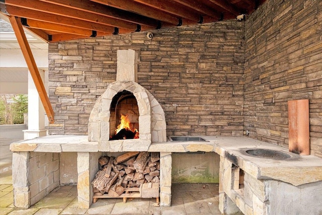 details featuring stone siding and an outdoor stone fireplace