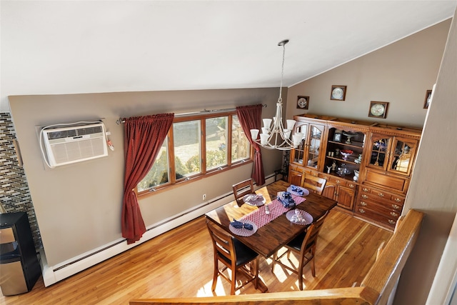 dining area with lofted ceiling, an inviting chandelier, a wall mounted air conditioner, light hardwood / wood-style flooring, and a baseboard heating unit