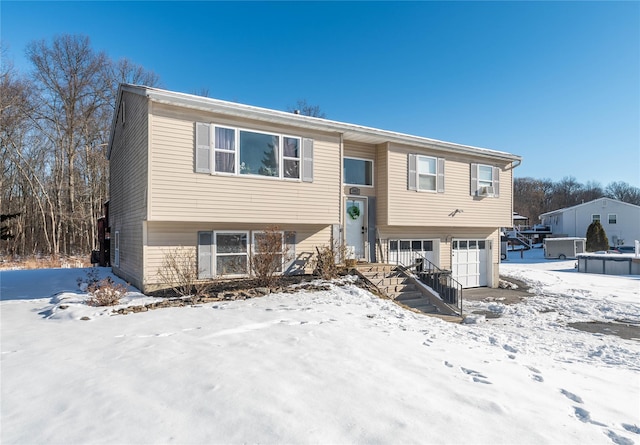 split foyer home featuring a garage