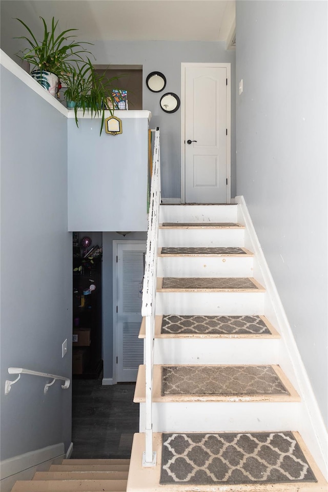 stairs with wood-type flooring