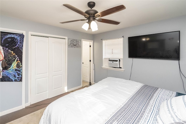 carpeted bedroom featuring cooling unit and ceiling fan