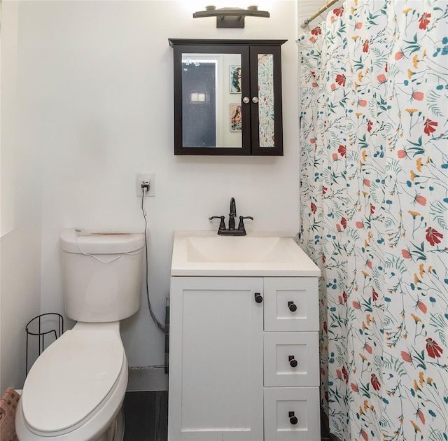 bathroom with vanity, toilet, and a shower with shower curtain