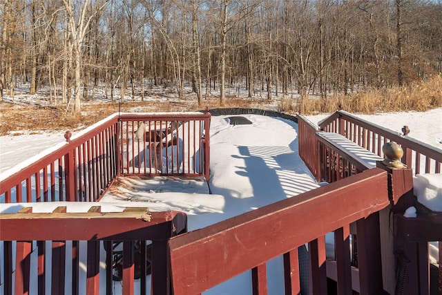 view of snow covered deck