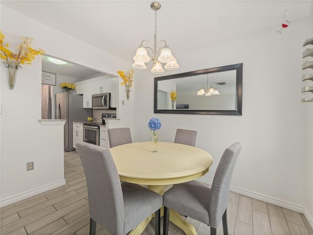 dining room featuring a notable chandelier