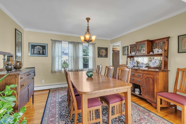 dining space with a baseboard radiator, crown molding, an inviting chandelier, and light hardwood / wood-style floors