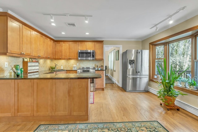 kitchen featuring backsplash, ornamental molding, stainless steel appliances, and light wood-type flooring