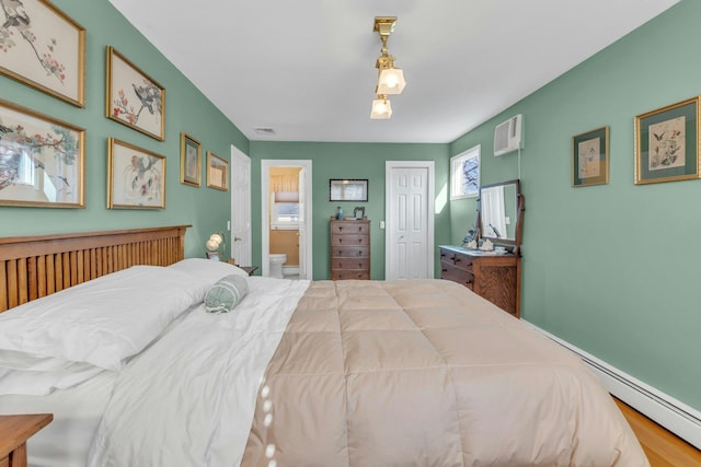 bedroom with ensuite bath and a closet