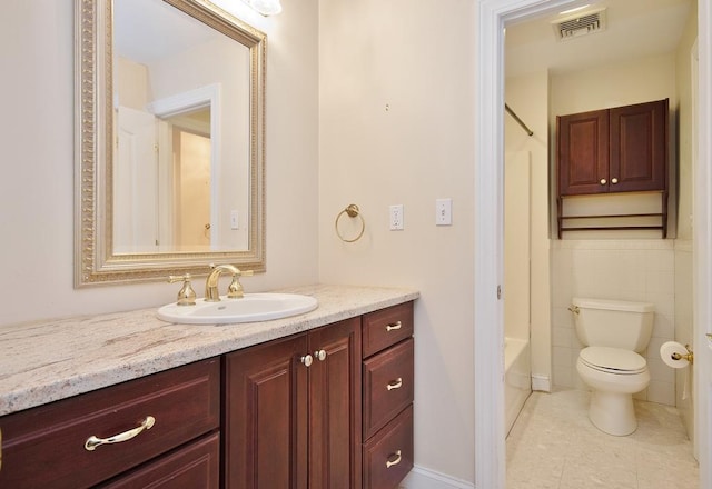 full bath with bathtub / shower combination, visible vents, toilet, vanity, and tile patterned floors