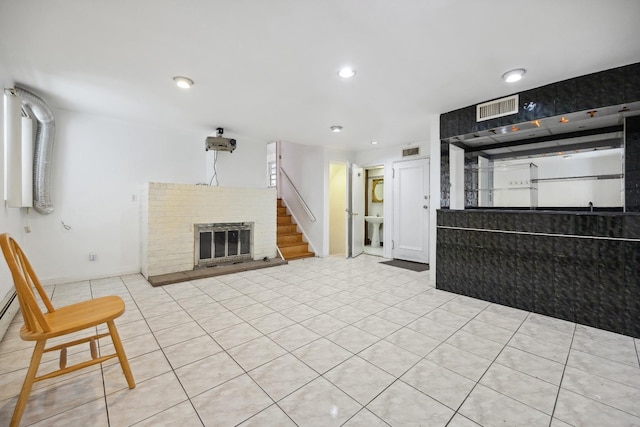 unfurnished living room with a brick fireplace