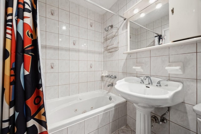 bathroom featuring shower / bath combination with curtain, tasteful backsplash, and tile walls