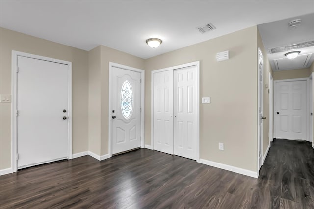 entrance foyer with dark hardwood / wood-style floors