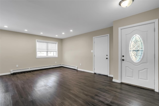 entryway with dark hardwood / wood-style flooring and baseboard heating