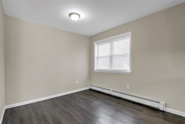 unfurnished room featuring dark wood-type flooring and a baseboard radiator