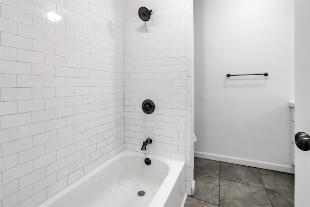 bathroom with tile patterned floors and tiled shower / bath